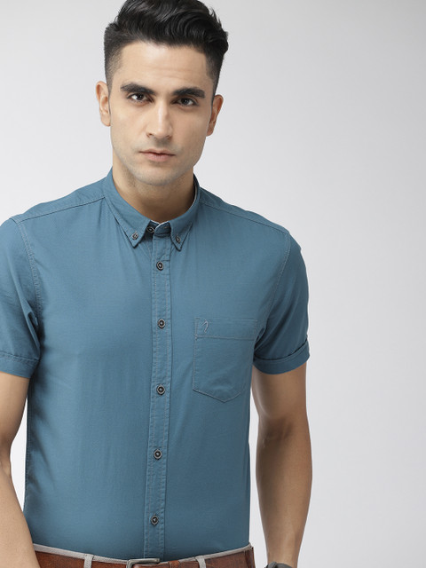 

Indian Terrain Men Teal Blue Chiseled Slim Fit Solid Smart Casual Shirt