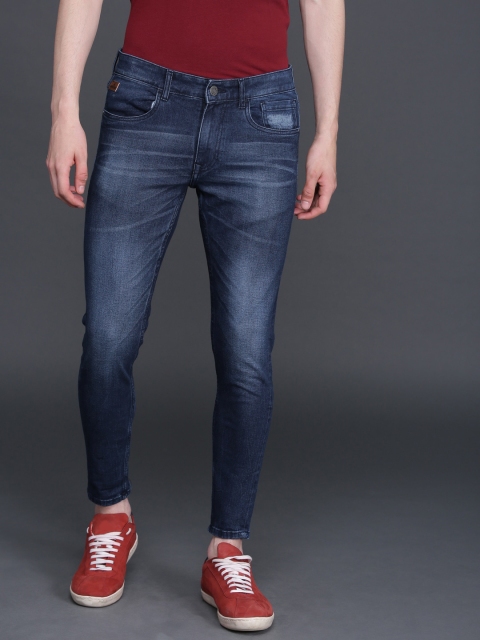 Men Blue Tapered Fit Mid-Rise Clean Look Stretchable Cropped Jeans
