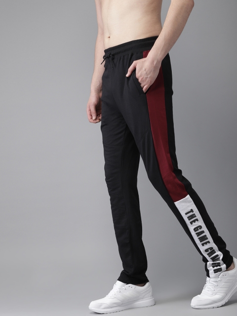 

Moda Rapido Men Black & Maroon Solid Track Pants