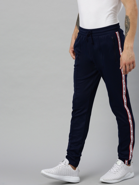 

Tommy Hilfiger Men Navy Blue Solid Straight Fit Track Pants with Printed Side Tape Detail