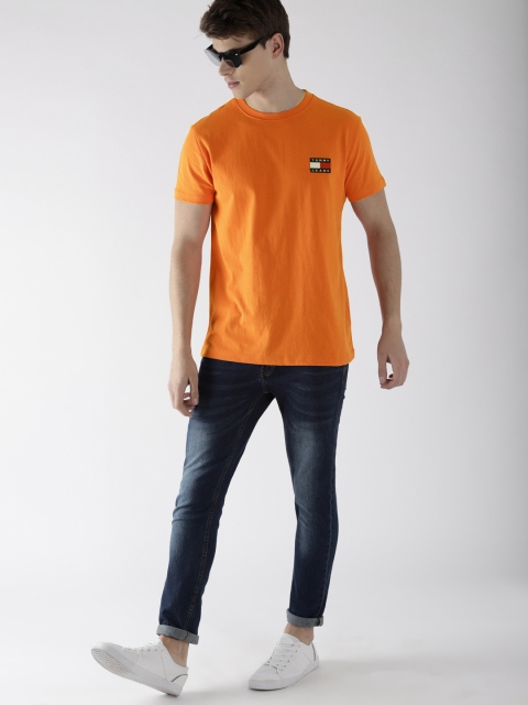 

Tommy Hilfiger Men Orange Solid Round Neck T-shirt
