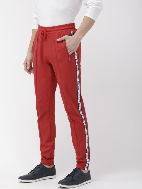 

Tommy Hilfiger Men Red Solid Straight Fit Track Pants