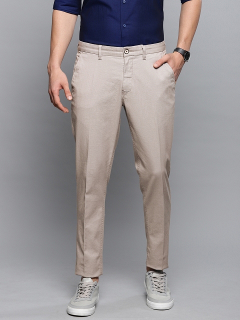 

Louis Philippe Sport Men Beige & White Slim Fit Self Design Regular Trousers