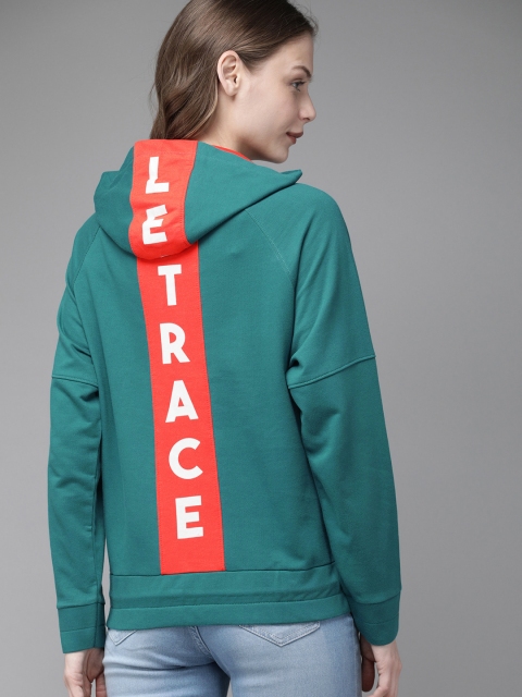 

Roadster Women Teal Green Solid Hooded Sweatshirt