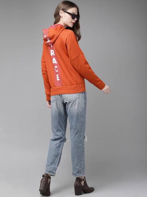 

Roadster Women Orange Solid Hooded Sweatshirt With Printed Back