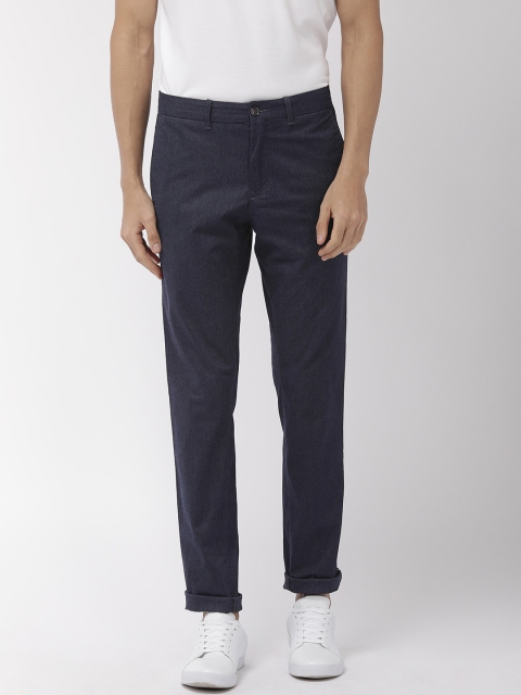 

Tommy Hilfiger Men Navy Blue Self Design Slim Fit Regular Trousers