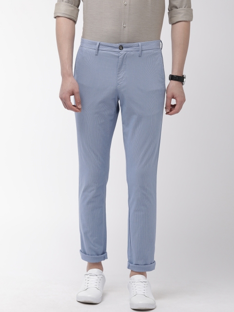 

Tommy Hilfiger Men Blue & White Regular Fit Self Striped Chinos