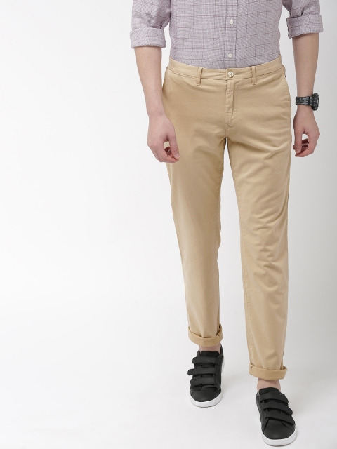 

Tommy Hilfiger Men Beige Straight Fit Solid Chinos