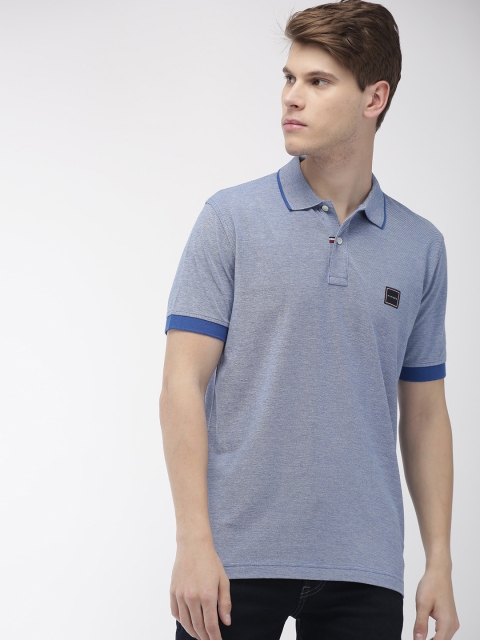 

Tommy Hilfiger Men Blue Solid Polo Collar T-shirt