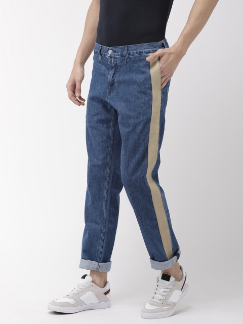 

Tommy Hilfiger Men Blue Regular Fit Mid-Rise Clean Look Stretchable Jeans