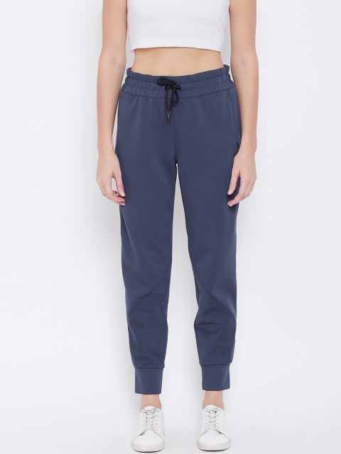 

Reebok Women Navy Blue Solid Training Supply Knit Pants
