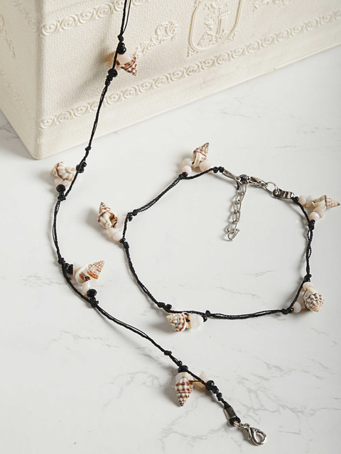 

Priyaasi Women Black & Off-White Sea Shell & Beaded Handcrafted Anklets