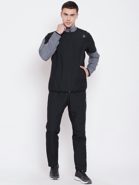 

Reebok Men Black Solid Training Essential Woven Training Tracksuit