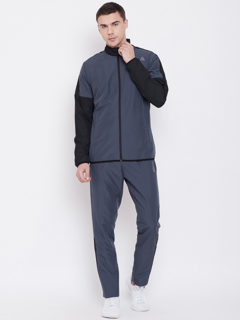 

Reebok Men Navy Blue Solid Training Essential Woven Tracksuit