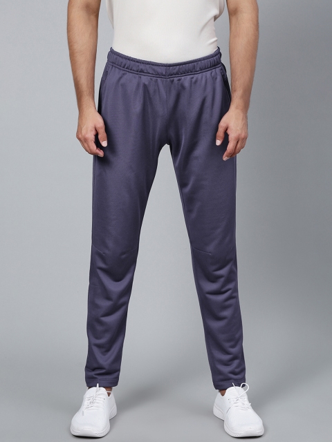 

Reebok Men Purple Solid Training Foundation Base Track Pants