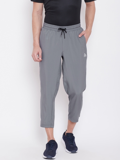 

Reebok Men Grey Solid Training Workout Woven Cropped Track Pants