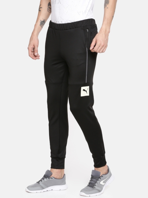

Puma Men Black Solid ESS Logo Track Pant