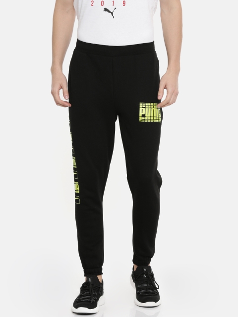

Puma Men Black Solid Straight Fit Rebel Bold cl FL Joggers With Printed Detailing
