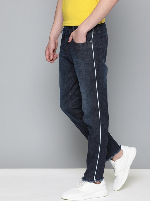 

Mast & Harbour Men Blue Carrot Fit Mid-Rise Clean Look Stretchable Jeans