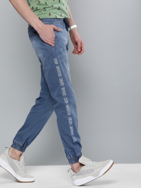 

Mast & Harbour Men Blue Jogger Mid-Rise Clean Look Stretchable Jeans With Printed Detail