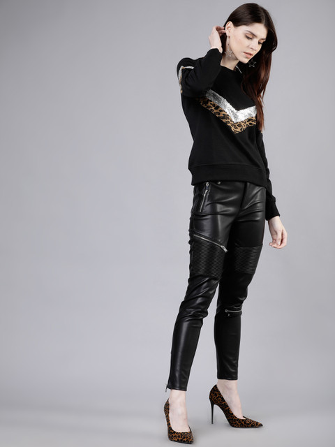 

Tokyo Talkies Women Black & Silver-Toned Solid Sweatshirt