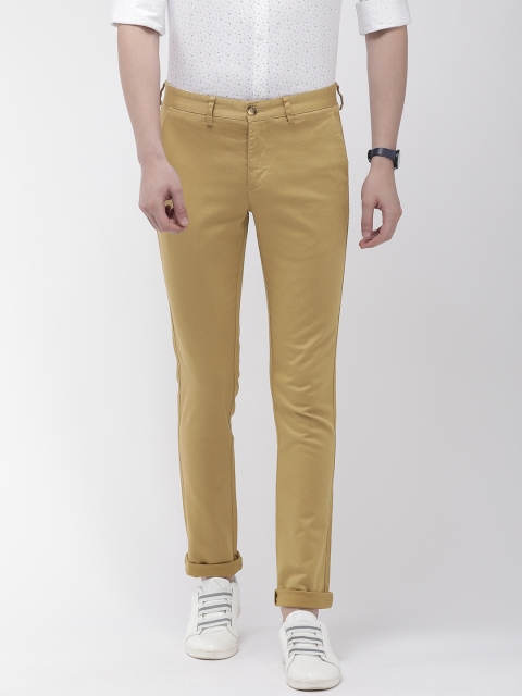 

Park Avenue Men Khaki Neo Fit Self Design Regular Trousers