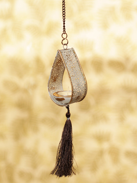 

ExclusiveLane White Rustic Mughal Leaf Drop Handcrafted Hanging Tea-Light Holder
