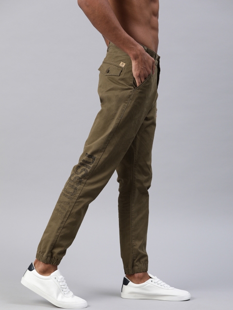 

HERE&NOW Men Olive Green Regular Fit Solid Joggers With Printed Detail