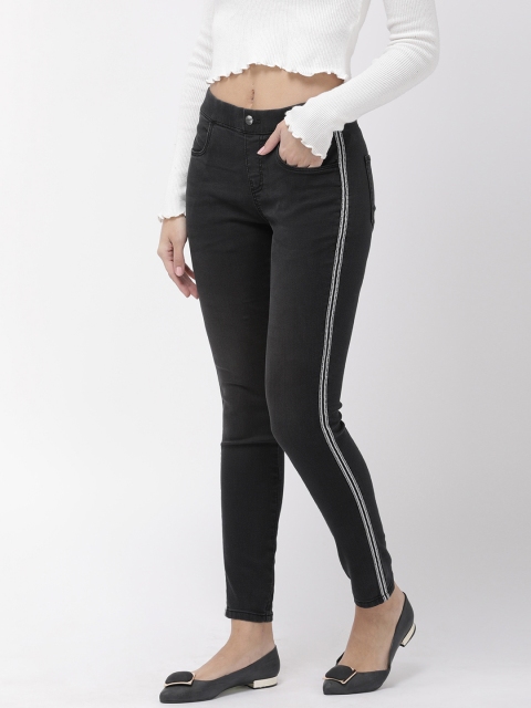 

Go Colors Women Black Solid Jeggings with Side Striped Detail