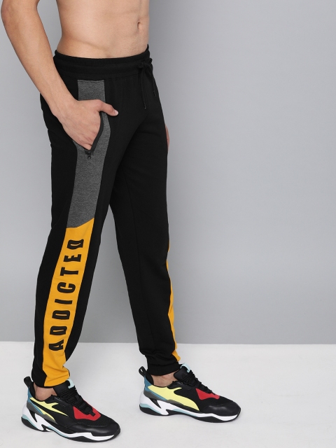 

HERE&NOW Men Black Solid Straight Fit Joggers with Side Stripes