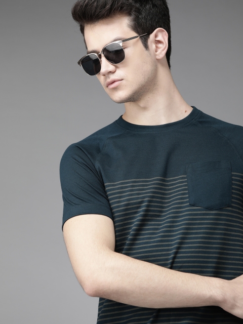 

Roadster Men Navy Blue Striped Round Neck T-shirt