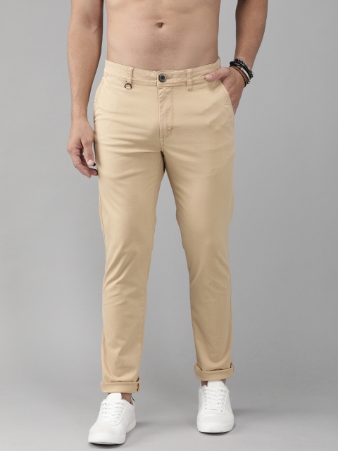 

The Roadster Lifestyle Co Men Beige Slim Fit Self-Design Regular Trousers, Peach