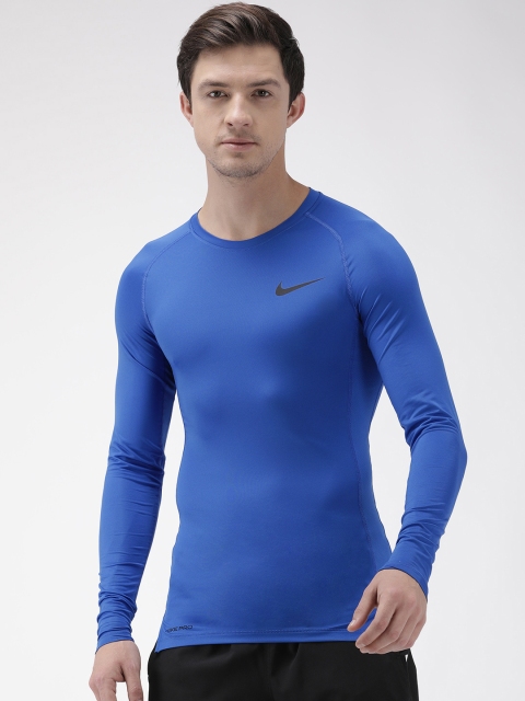 

Nike Men Blue Solid Round Neck DRI-FIT AS M NP TOP LS TIGHT Fit T-shirt