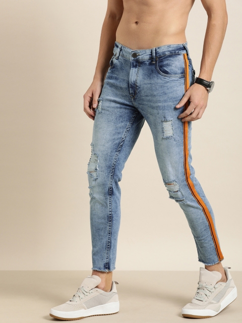 

Moda Rapido Men Blue Slim Tapered Fit Mid-Rise Mildly Distressed Jeans With Side Stripes