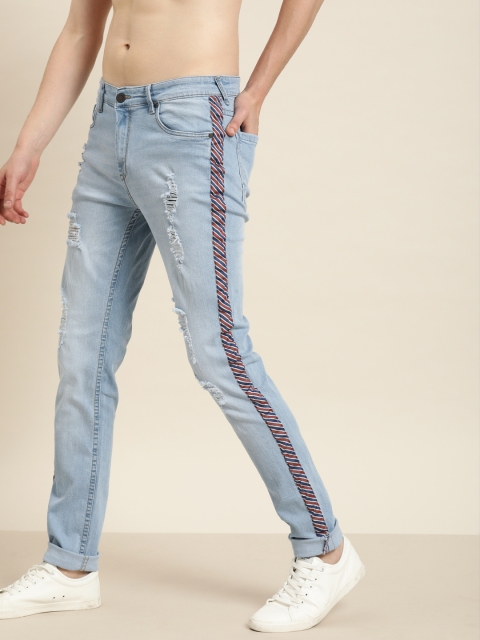 

Moda Rapido Men Blue Slim Fit Mid-Rise Highly Distressed Jeans With Side Stripes