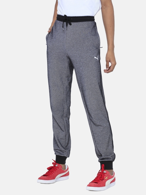 

Puma Men Black & Grey Solid Track Pants