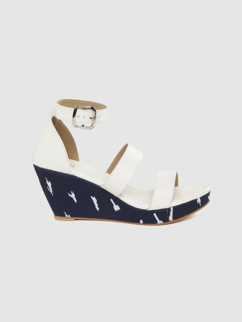 

Taavi Women Off-White Solid Wedges