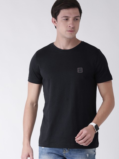 

Tommy Hilfiger Men Navy Blue Solid Round Neck Pure Cotton T-shirt With Applique Detailing