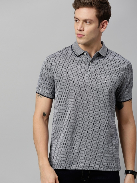 

Indian Terrain Men White Navy Blue Self Design Polo Collar Pure Cotton T-shirt