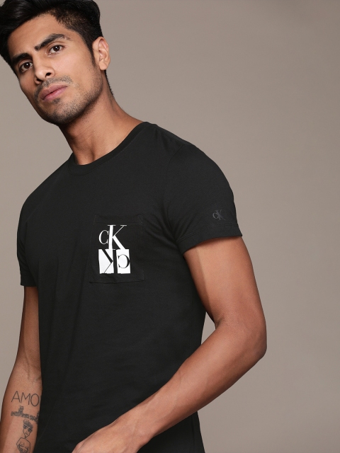

Calvin Klein Jeans Men Black Solid Round Neck T-shirt With Printed Detail