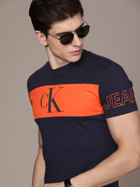 

Calvin Klein Jeans Men Navy Blue & Orange Slim Fit Striped Round Neck T-shirt