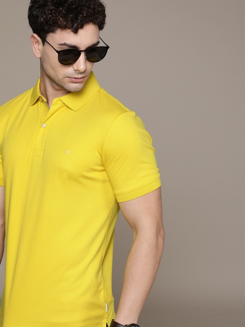 

Calvin Klein Jeans Men Mustard Yellow Solid Slim Fit Polo Collar T-shirt