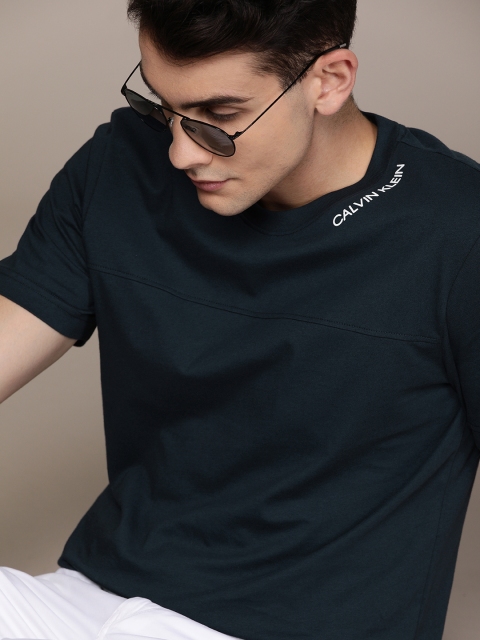 

Calvin Klein Jeans Men Navy Blue Solid Round Neck T-shirt with Printed Detail