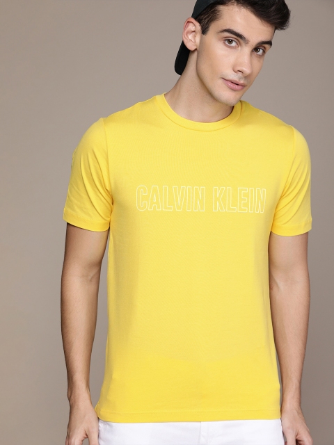 

Calvin Klein Jeans Men Yellow Solid Round Neck T-shirt With Printed Detail