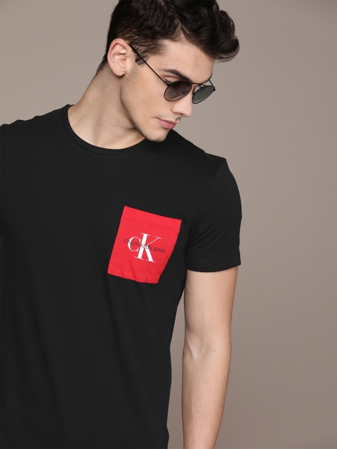 

Calvin Klein Jeans Men Black Solid Round Neck T-shirt With a Print Detailed Pocket