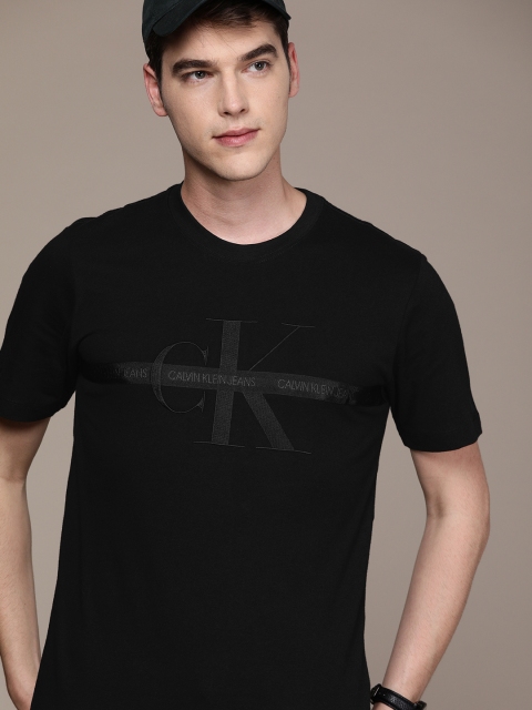 

Calvin Klein Jeans Men Black Solid Round Neck Pure Cotton T-shirt with Applique Detail