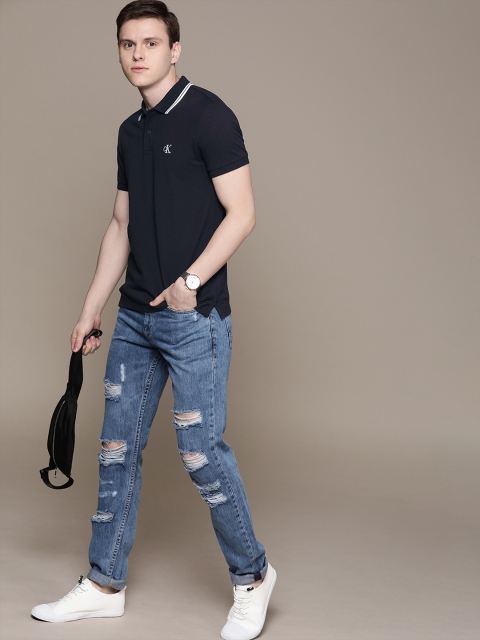 

Calvin Klein Jeans Men Navy Blue Solid Polo Collar T-shirt