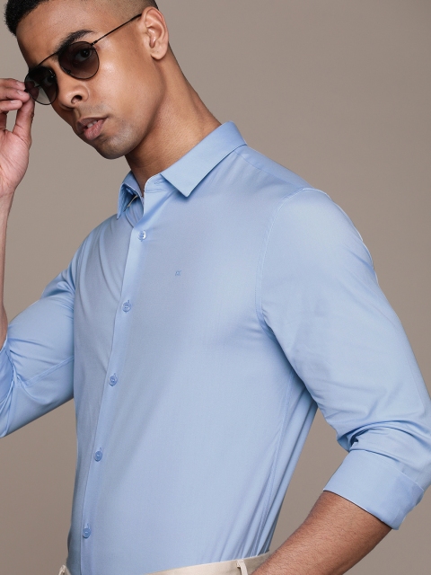 

Calvin Klein Jeans Men Blue Slim Fit Solid Smart Casual Shirt