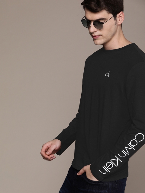 

Calvin Klein Jeans Men Black Solid Round Neck T-shirt With Printed Detail