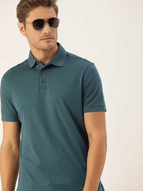 

Calvin Klein Jeans Men Blue Solid Polo Collar Pure Cotton T-shirt